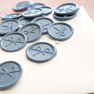 dusty blue wax seal stickers with a trendy bow design for weddings and baby showers 