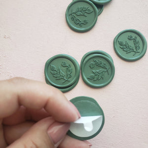 self-adhesive wax seals in dark green with botanical design