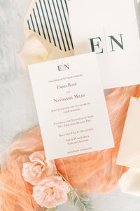 simple and elegant wedding invitation set with striped envelope liner and blush envelopes