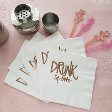 Load image into Gallery viewer, white paper napkins with drunk in love stamped in rose gold foil