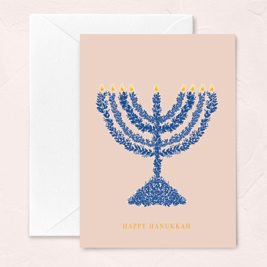 hanukkah greeting card in blush with a blue floral menorah illustration