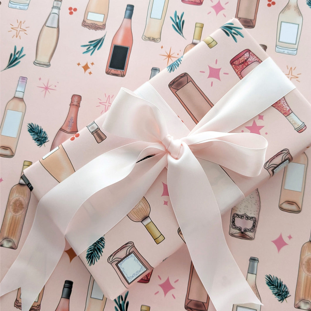 pink christmas wrapping sheets with wine bottle illustrations