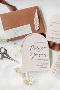 boho arch wedding invitation cards with terracotta envelopes and modern script fonts