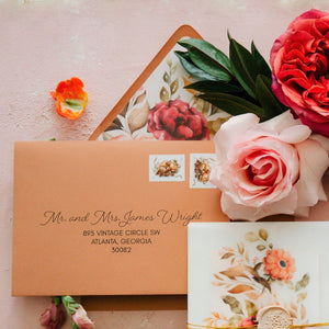 terracotta wedding invitation envelope with script font and floral envelope liner